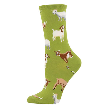 A pair of green crew socks with a pattern of various goats in different shades of gray, white, and brown.